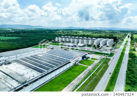 Solar energy for factory and warehouse building. Solar panels on roof of industrial plant. Commercial solar power. Rooftop solar power. Rooftop renewable energy system. Sustainable green energy. 140467324