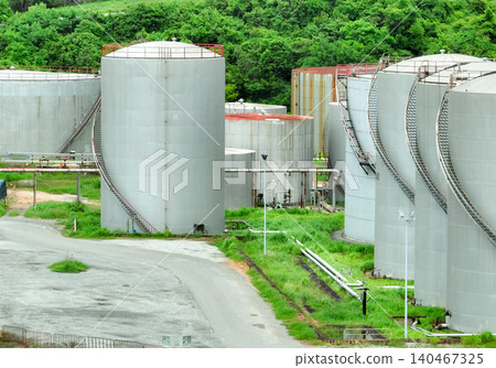 Gas storage tanks in oil refinery and petrochemical plant. Pipelines and industrial infrastructure for energy production and fuel storage in oil and gas industry. Energy supply and fuel production. 140467325