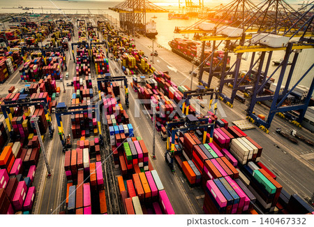 Logistics and transportation of container cargo ship at ship port. Container truck and crane bridge in shipyard. Import export and transport industry. Terminal port for export transport by ship. Logistics and transportation of container cargo ship at ship port. Container truck and crane bridge in shipyard. Import export and transport industry. Terminal port for export transport by ship. 140467332