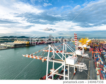 Logistics and transportation of container cargo ship at ship port. Container truck and crane bridge in shipyard. Import export and transport industry. Terminal port for export transport by ship. Logistics and transportation of container cargo ship at ship port. Container truck and crane bridge in shipyard. Import export and transport industry. Terminal port for export transport by ship. 140467338