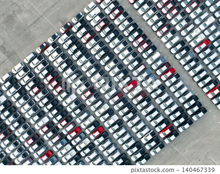 Aerial view of new cars stock at factory parking lot. Above view cars parked in a row. Automotive industry. Logistics business. Import or export new cars at warehouse. Big parking lot at port terminal Aerial view of new cars stock at factory parking lot. Above view cars parked in a row. Automotive industry. Logistics business. Import or export new cars at warehouse. Big parking lot at port terminal 140467339