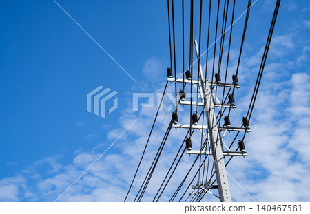 Electricity transmission pylon. Transmission tower collect electricity from wind turbines for sustainable energy. Clean power. Renewable energy infrastructure. Electricity high-voltage lines. Electricity transmission pylon. Transmission tower collect electricity from wind turbines for sustainable energy. Clean power. Renewable energy infrastructure. Electricity high-voltage lines. 140467581