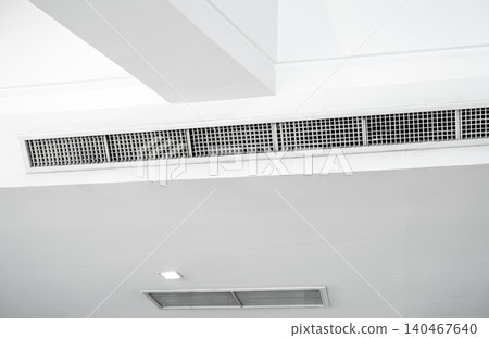 Air flow and ventilation system. Air Handling Units on ceiling walls for efficient cooling. Building ventilation. Air Handling Units and climate control systems. Ceiling-mounted ventilation units. Air flow and ventilation system. Air Handling Units on ceiling walls for efficient cooling. Building ventilation. Air Handling Units and climate control systems. Ceiling-mounted ventilation units. 140467640