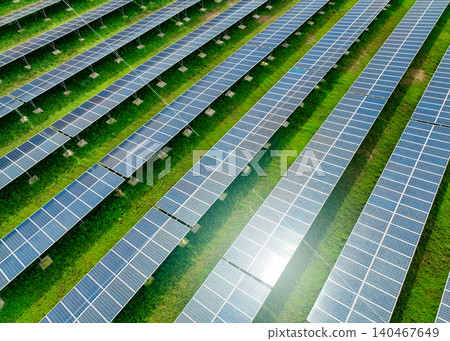 Solar farm and sun light. Solar power for green energy. Sustainable renewable energy. Photovoltaic power station or solar park. Solar panel installation and maintenance concept. Energy sustainability. Solar farm and sun light. Solar power for green energy. Sustainable renewable energy. Photovoltaic power station or solar park. Solar panel installation and maintenance concept. Energy sustainability. 140467649
