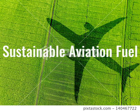Sustainable aviation fuel concept. Airplane flying above green field. Biofuel in aviation. Sustainable transportation and eco-friendly flight with biofuel use. Aviation sustainability. Air travel. Sustainable aviation fuel concept. Airplane flying above green field. Biofuel in aviation. Sustainable transportation and eco-friendly flight with biofuel use. Aviation sustainability. Air travel. 140467722
