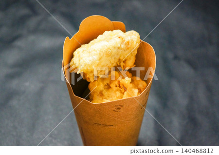Takeout style: Freshly fried tempura in paper cups. Takeout style: Freshly fried tempura in paper cups. 140468812