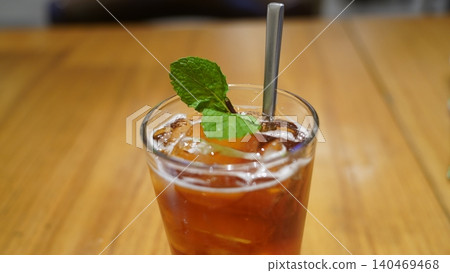 Refreshing Iced Tea with Mint Garnish and Metal Straw Refreshing Iced Tea with Mint Garnish and Metal Straw 140469468