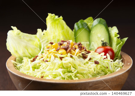 A salad bowl topped with fresh vegetables and ground meat, a nutritious and healthy meal. A salad bowl topped with fresh vegetables and ground meat, a nutritious and healthy meal. 140469627