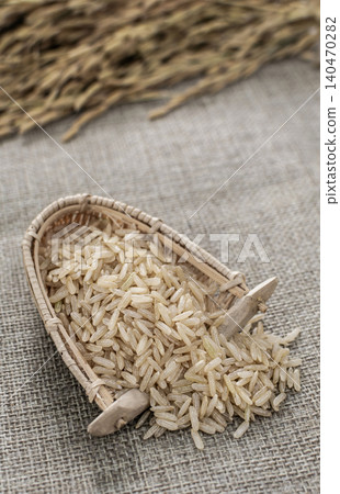 unhulled asian brown rice grains in rustic setting display in Cambodia unhulled asian brown rice grains in rustic setting display in Cambodia 140470282