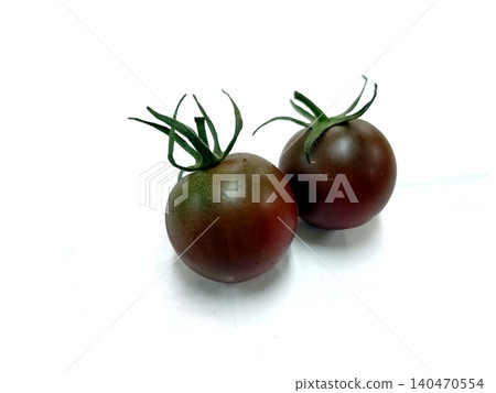 Two black cherry tomatoes Two black cherry tomatoes 140470554