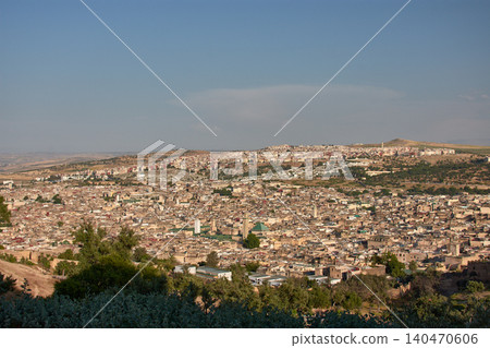 An aerial perspective reveals the complex historical architecture and mosques of the ancient city of Fez in Morocco An aerial perspective reveals the complex historical architecture and mosques of the ancient city of Fez in Morocco 140470606