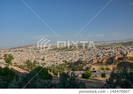 An aerial perspective reveals the complex historical architecture and mosques of the ancient city of Fez in Morocco An aerial perspective reveals the complex historical architecture and mosques of the ancient city of Fez in Morocco 140470607
