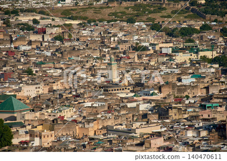 An aerial perspective reveals the complex historical architecture and mosques of the ancient city of Fez in Morocco An aerial perspective reveals the complex historical architecture and mosques of the ancient city of Fez in Morocco 140470611