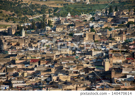 An aerial perspective reveals the complex historical architecture and mosques of the ancient city of Fez in Morocco An aerial perspective reveals the complex historical architecture and mosques of the ancient city of Fez in Morocco 140470614