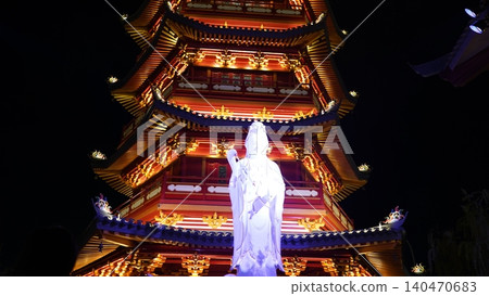 Beautiful Pagoda and Statue at Nighttime Beautiful Pagoda and Statue at Nighttime 140470683