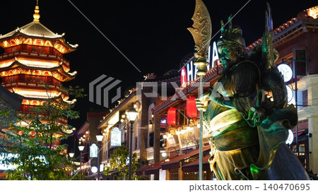 Chinese architecture at night with statue and pagoda Chinese architecture at night with statue and pagoda 140470695