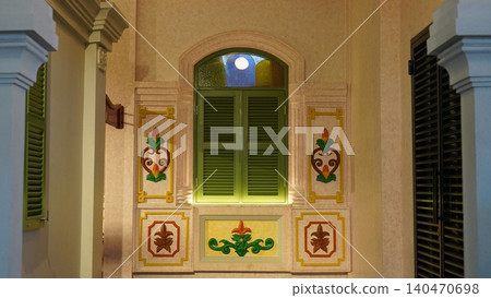 Vintage Window with Green Shutters and Floral Decorations Vintage Window with Green Shutters and Floral Decorations 140470698