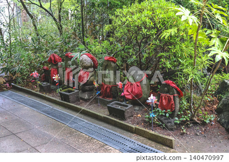 April 29 2026 Jizo statues lined along forest pathway 140470997