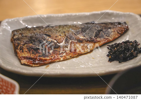 Grilled mackerel fillet served with seaweed side dish 140471087