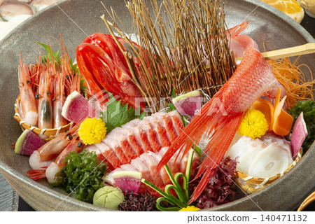 A luxurious seafood sashimi platter featuring rockfish and sweet shrimp from Hokkaido. A luxurious seafood sashimi platter featuring rockfish and sweet shrimp from Hokkaido. 140471132