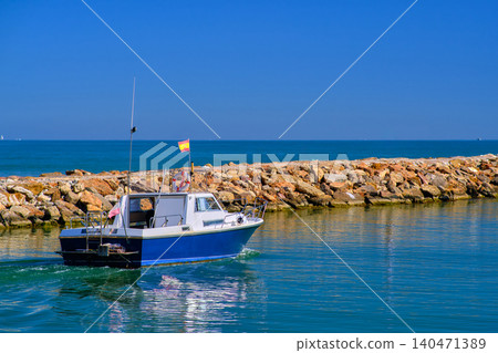 Motor boat going out to sea Motor boat going out to sea 140471389