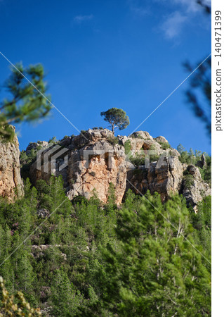 a rock against the blue sky 140471399