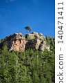 a rock against the blue sky 140471411