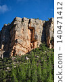 a rock against the blue sky 140471412