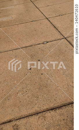 Concrete slabs forming geometric pattern on pavement 140471610