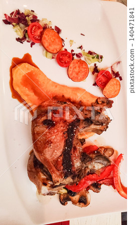 Grilled pork chop with sweet potato puree, vegetables and salad in croatia 140471841