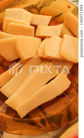 Sliced cheese on decorative plate, ready for summer vacation in croatia Sliced cheese on decorative plate, ready for summer vacation in croatia 140471994