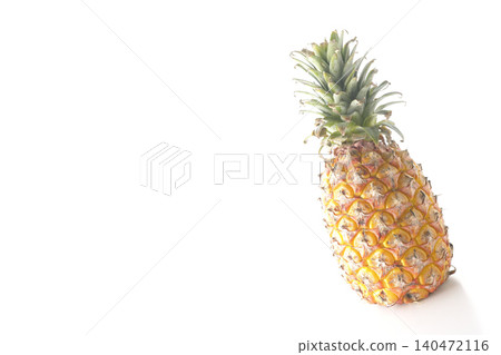 A pineapple photographed alone against a white background. 140472116