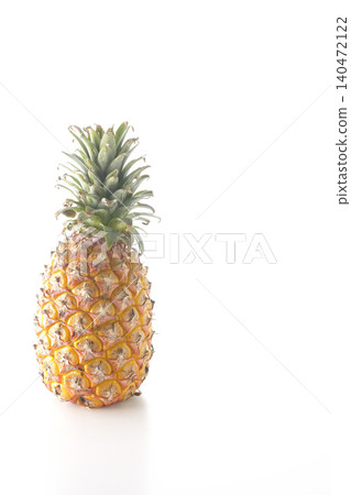 A pineapple photographed alone against a white background. A pineapple photographed alone against a white background. 140472122