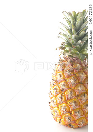 A pineapple photographed alone against a white background. A pineapple photographed alone against a white background. 140472126