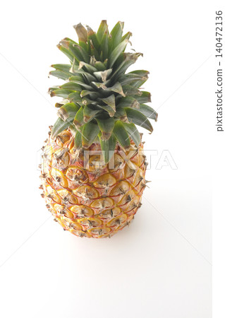 A pineapple photographed alone against a white background. A pineapple photographed alone against a white background. 140472136