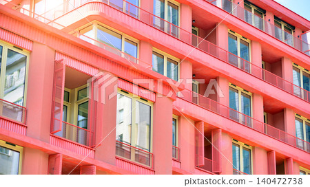 View of modern residential building with glass balconies and bright facade. Contemporary apartment building in european city. Concept of urban living and modern architecture. View of modern residential building with glass balconies and bright facade. Contemporary apartment building in european city. Concept of urban living and modern architecture. 140472738