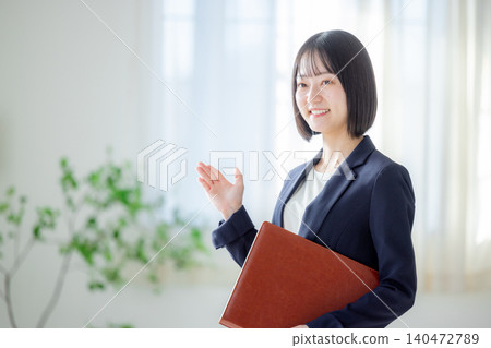 A woman with a binder 140472789