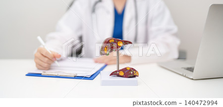 Doctor with human Liver anatomy model. Liver cancer and Tumor, Jaundice, Viral Hepatitis A, B, C, D, E, Cirrhosis, Failure, Enlarged, Hepatic Encephalopathy, Ascites Fluid in Belly and health concept Doctor with human Liver anatomy model. Liver cancer and Tumor, Jaundice, Viral Hepatitis A, B, C, D, E, Cirrhosis, Failure, Enlarged, Hepatic Encephalopathy, Ascites Fluid in Belly and health concept 140472994