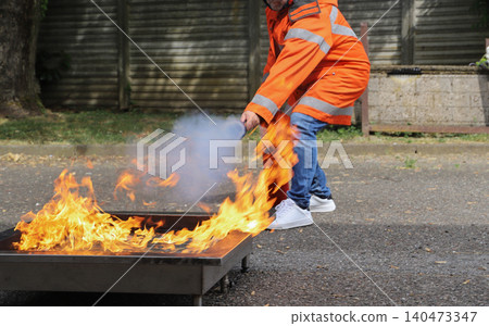 fire prevention. corporate safety - exercise during a firefighting course fire prevention. corporate safety - exercise during a firefighting course 140473347