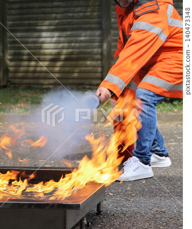 fire prevention. corporate safety - exercise during a firefighting course fire prevention. corporate safety - exercise during a firefighting course 140473348