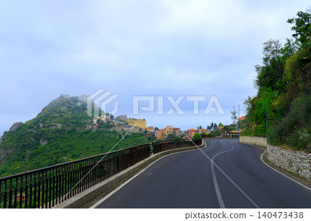 scenic mountain spiral asphalt road spiral of highland area with picturesque landscape misty weather cloudscape scenic mountain spiral asphalt road spiral of highland area with picturesque landscape misty weather cloudscape 140473438