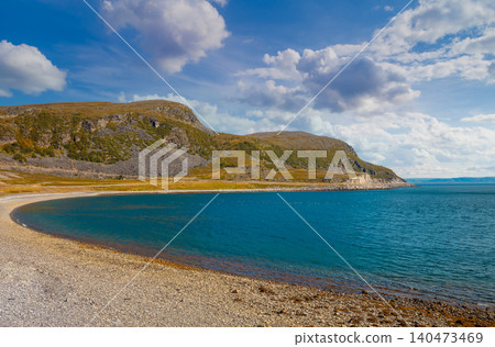 Rocky seashore. Wilderness. Beautiful nature of Norway. Open sea on a sunny day. Scandinavian nature landscape Rocky seashore. Wilderness. Beautiful nature of Norway. Open sea on a sunny day. Scandinavian nature landscape 140473469