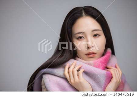 A woman wearing a muffler A woman wearing a muffler 140473519