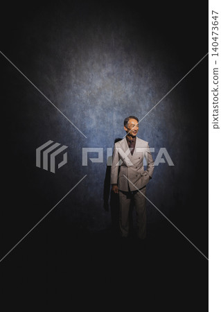 A businessman deep in thought in a dark place A businessman deep in thought in a dark place 140473647