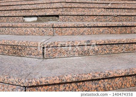 Detailed Close-Up of Weathered Stone Steps with Visible Wear and Tear in Urban Environment Detailed Close-Up of Weathered Stone Steps with Visible Wear and Tear in Urban Environment 140474358