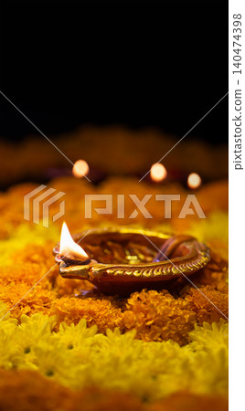 Clay diya lamps lit during diwali celebration, Diwali, or Deepavali, is India's biggest and most important holiday. Clay diya lamps lit during diwali celebration, Diwali, or Deepavali, is India's biggest and most important holiday. 140474398
