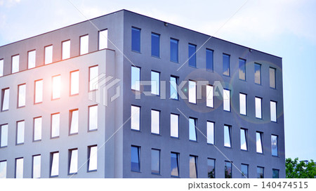 Facade of an old industrial office building with a predominance of old cement and old structural elements. Facade of an old industrial office building with a predominance of old cement and old structural elements. 140474515