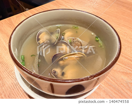 A seafood soup packed with clams. A close-up of the clams. A seafood soup packed with clams. A close-up of the clams. 140474558