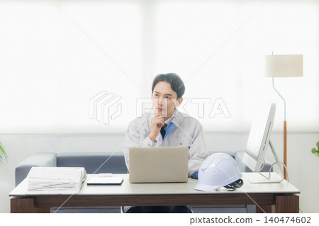 A worker making a phone call in the office 140474602