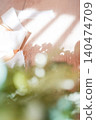 A soft background with a green foreground and ribbons. 140474709